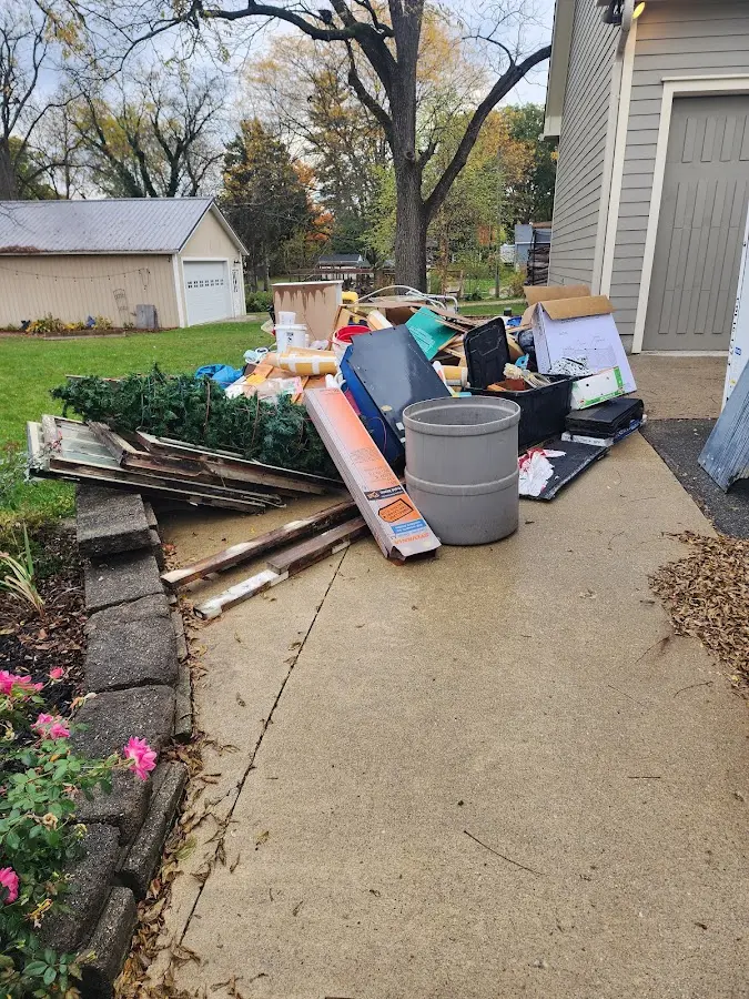 Dumpster being loaded with debris for Residential Dumpster Rental in Three Points